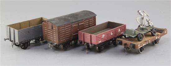 An LMS P & A open wagon, no.C19, in red, an open wagon in grey and S.R. flat truck with load, 12T,